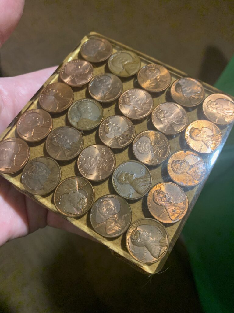 Coasters with cork bottoms and coins embedded inside.